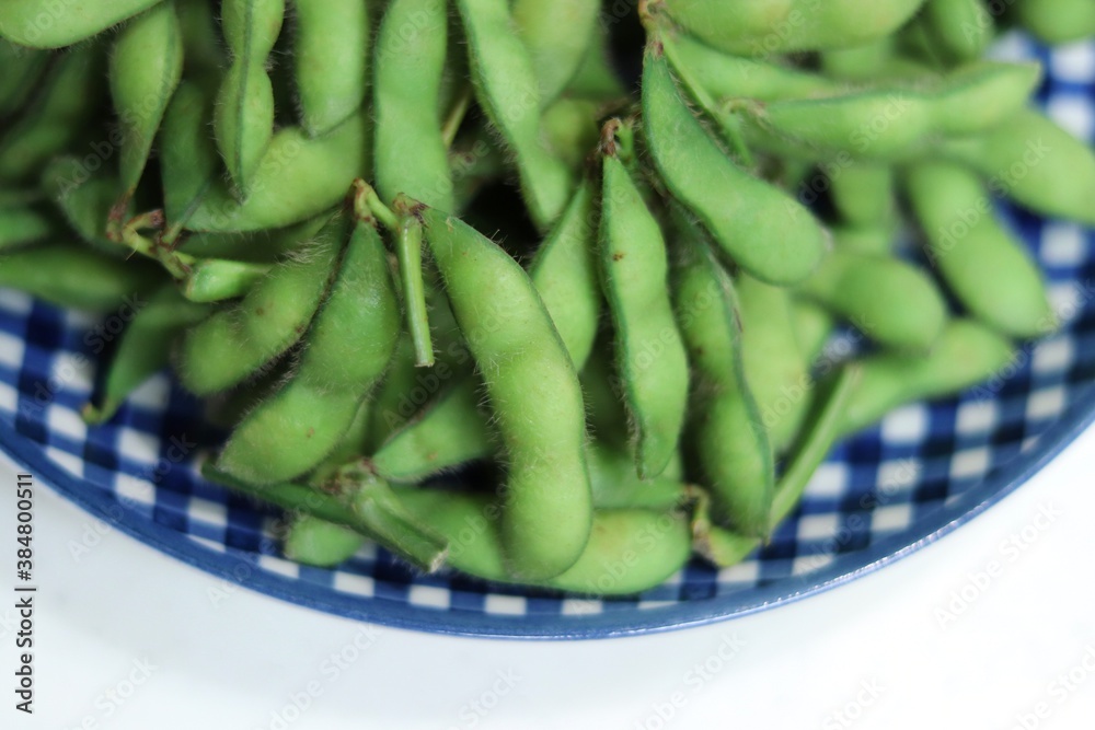 Boiled Edamame, green soybeans on a plate Boiled Edamame, green soybeans on a plate