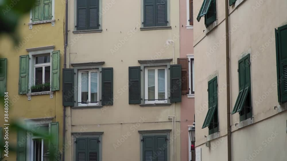 Riva Del Garda, Italy. Slow Motion of Windows on Residential Downtown Buildings. Romantic Idyllic City on Gardia Lake Riva Del Garda, Italy. Slow Motion of Windows on Residential Downtown Buildings. Romantic Idyllic City on Gardia Lake