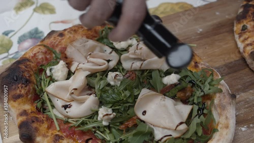 Chef puts sauce on top of Neapolitan pizza topping. Pizza making recipe. photo