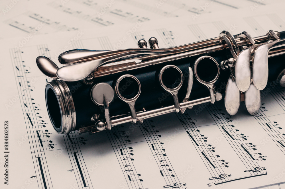 Obraz premium Close-up of musical notes and clarinet.