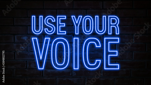 Use your voice - blue neon light word on brick wall background