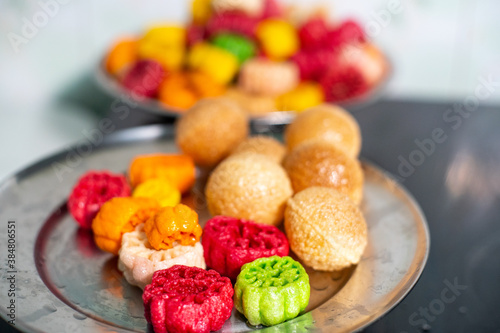 shot of colorful Fryums being deep fried in hot oil bubbling and sizzling with bubbles forming and size increasing of this popular north indian snack and street food