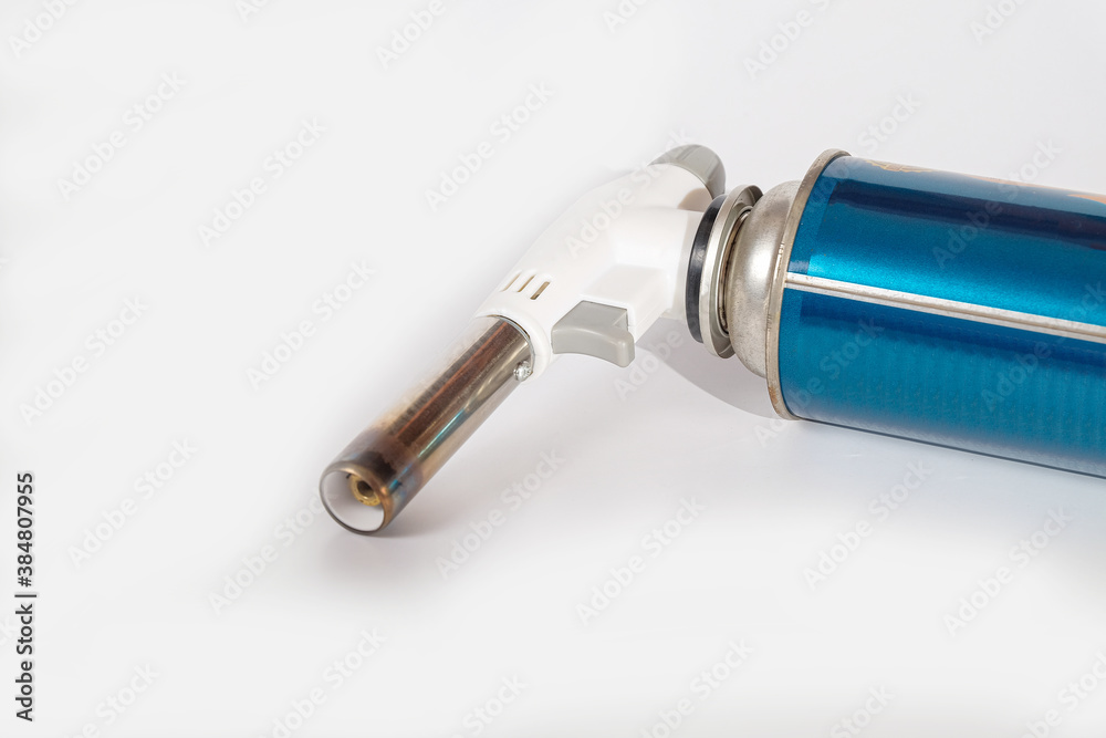 Heating Torches head tools on beltan gas can on background. Heating Torches head tools on beltan gas can on background.