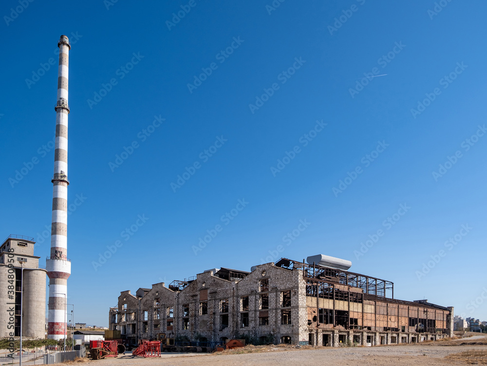 Old fertilizer industrial plant in Drapetsona Piraeus Greece, sunny day.