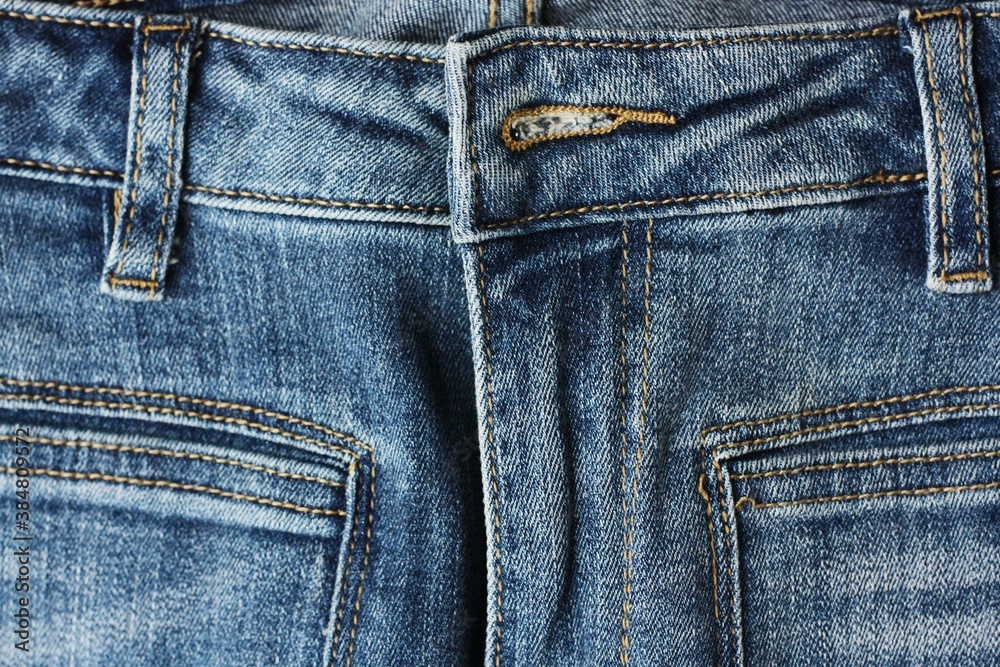 Beautiful blue jeans background close up view Beautiful blue jeans background close up view