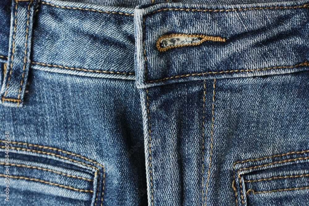 Beautiful blue jeans background close up view Beautiful blue jeans background close up view