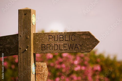 wooden signpost for public bridleway photo