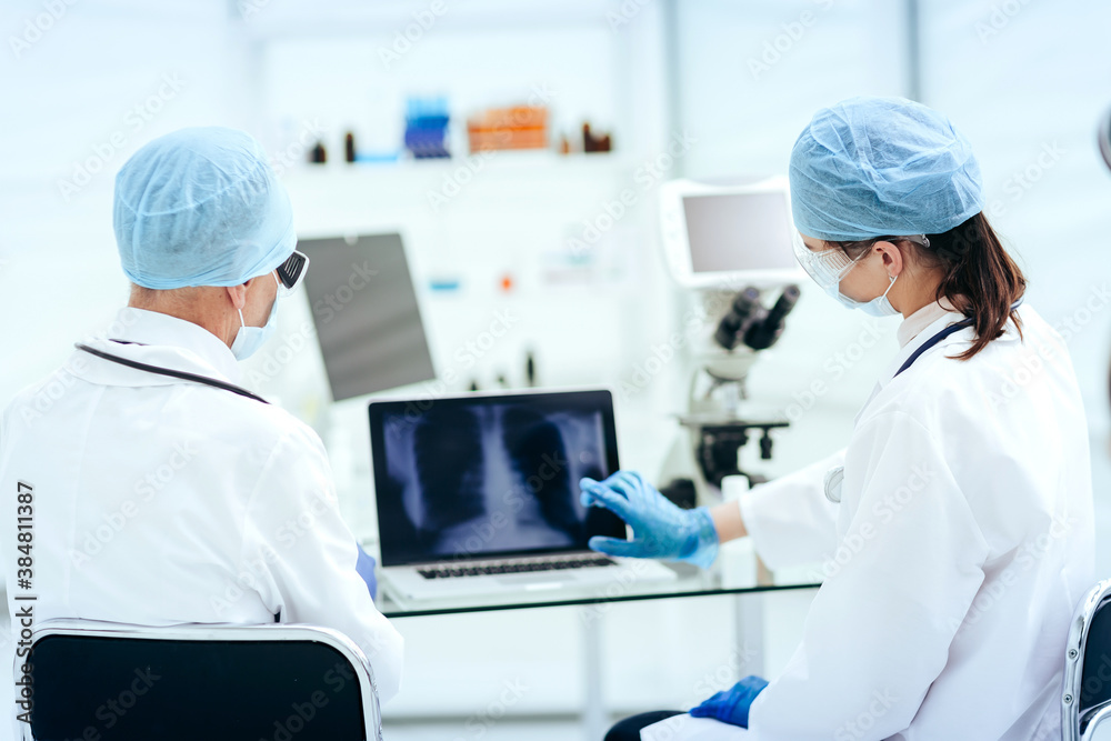close up. doctors discussing a chest x-ray. close up. doctors discussing a chest x-ray.