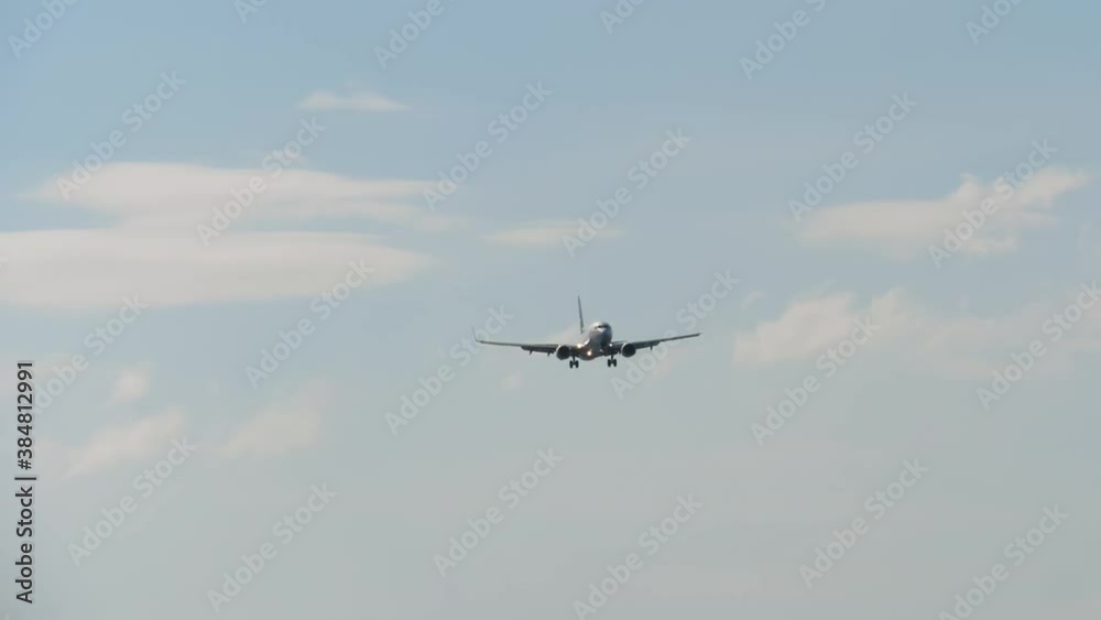 Airliner approaching the airport over ocean Airliner approaching the airport over ocean