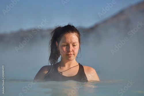 Enjoying hot thermal spa pool in Iceland