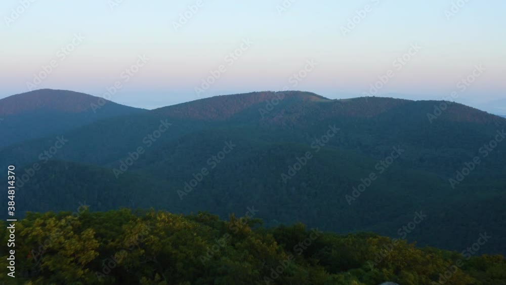Cole Mountain seen from the Mount Pleasant summit during a summer sunrise. An aerial shot (dolly out.) Located in the George Washington National Forest in the Blue Ridge Mountains in, Virginia. Cole Mountain seen from the Mount Pleasant summit during a summer sunrise. An aerial shot (dolly out.) Located in the George Washington National Forest in the Blue Ridge Mountains in, Virginia.
