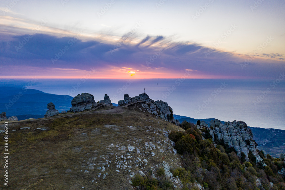 Fototapeta premium beautiful mountains at sunrise against the background of white clouds
