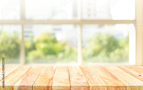 Empty wood table with blur  big window view background