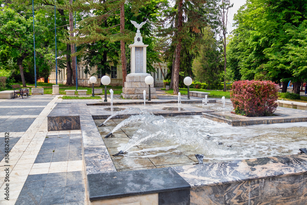 Main promenade in Sokobanja with a fountain and a monument Main promenade in Sokobanja with a fountain and a monument