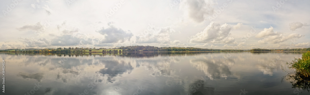 Panoramic view of lake on hazy autumn day
