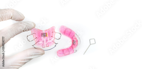 Doctors are holding a dentist, removable braces for children with crooked teeth