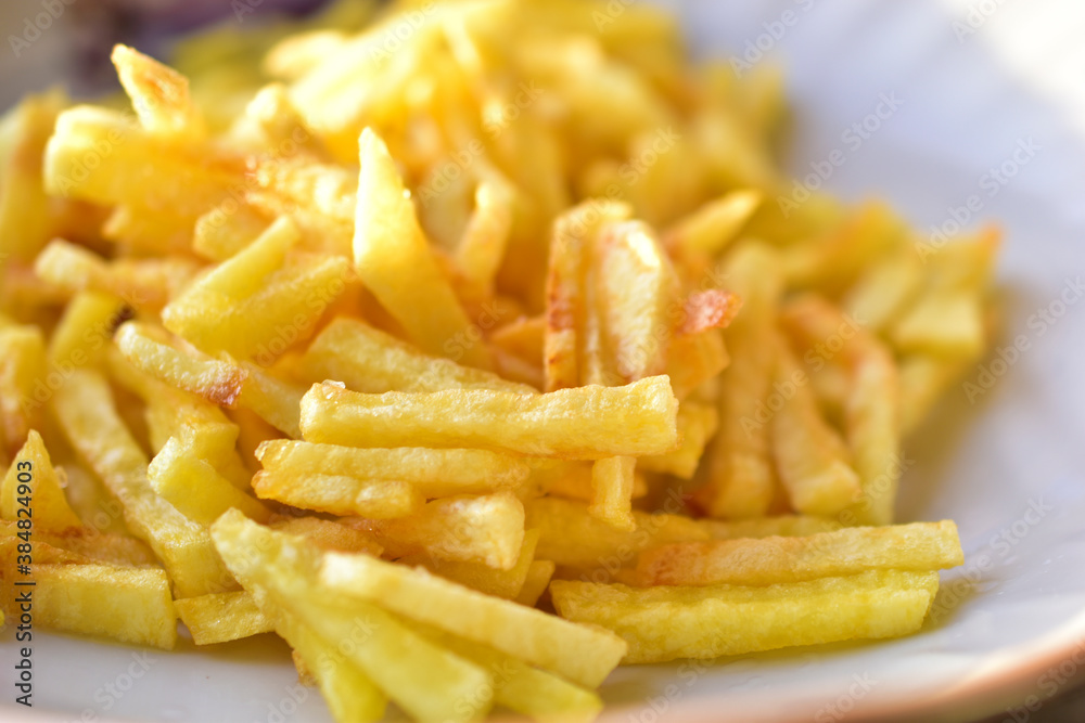 Ruddy delicious crispy French fries just fried close up Ruddy delicious crispy French fries just fried close up
