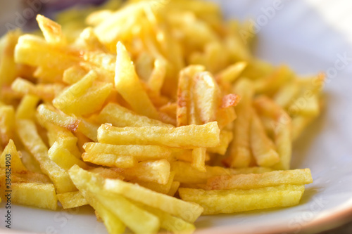 Ruddy delicious crispy French fries just fried close up