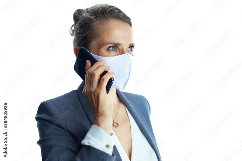 young female in grey suit on white talking on smartphone young female in grey suit on white talking on smartphone