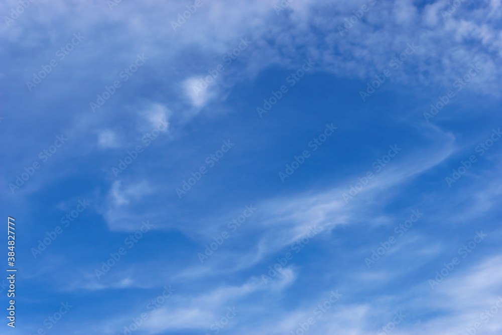 Cirrus clouds in the blue sky.