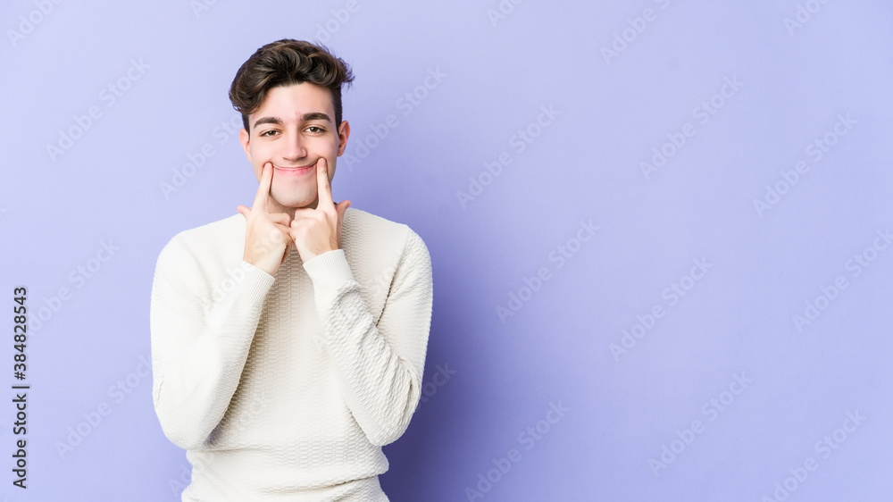 Young caucasian man isolated on purple background doubting between two options. Young caucasian man isolated on purple background doubting between two options.