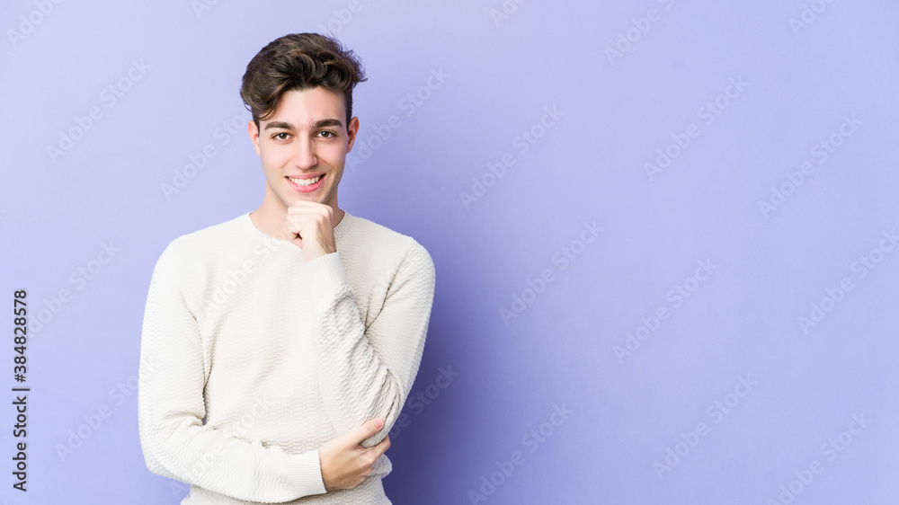 Young caucasian man isolated on purple background smiling happy and confident, touching chin with hand. Young caucasian man isolated on purple background smiling happy and confident, touching chin with hand.