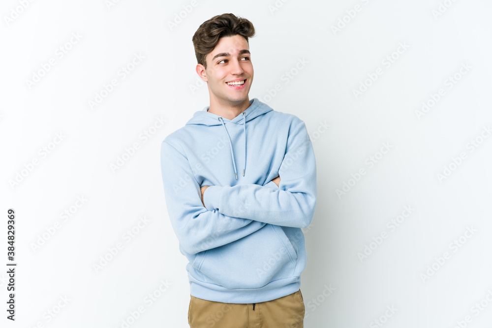 Young caucasian man isolated on white background smiling confident with crossed arms. Young caucasian man isolated on white background smiling confident with crossed arms.