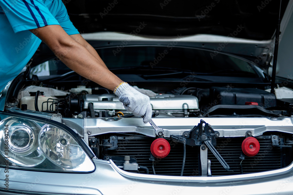 Auto mechanic working in garage. Repair service. Auto mechanic working in garage. Repair service.