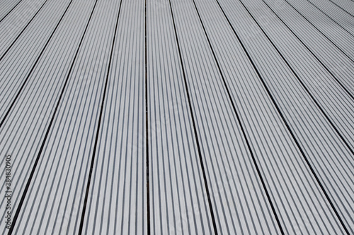 Dark gray or anthracite wpc material composite board deck for the construction of terrace.
