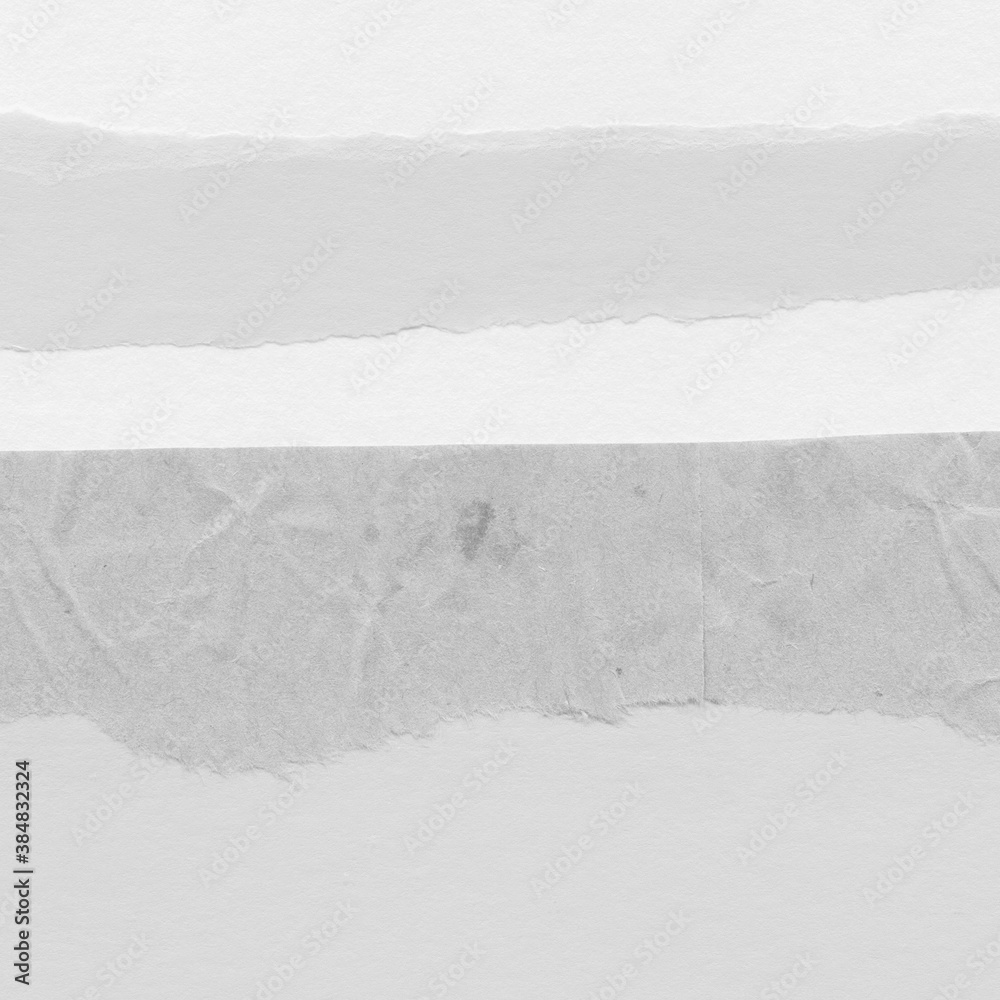 Obraz premium White torn paper collage close-up. Texture made from various paper and cardboard parts. Damaged old paper background. Vintage blank wallpaper. Material design backdrop.