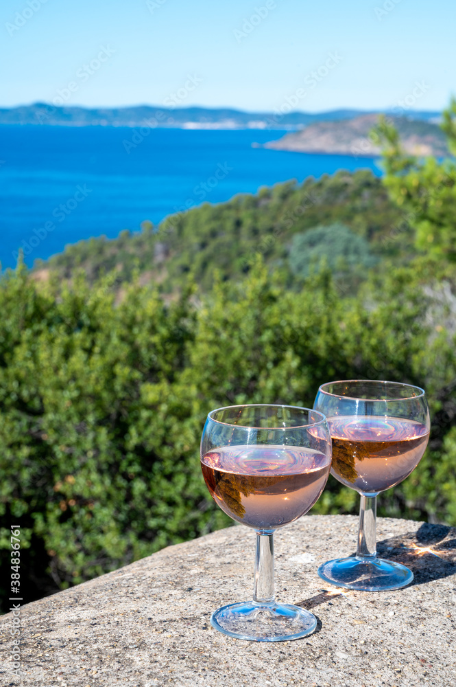 Picnic with of local rose wine and blue Mediterranean sea on background, near Saint-Tropez, Var, Provence, France