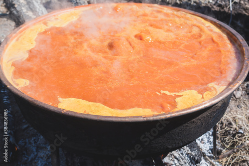 Making rosehip marmalade. Making rosehip marmalade in a large copper cauldron.