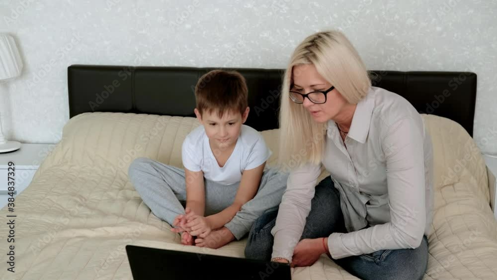 child and his mother study at home. My son is studying remotely. Home education child and his mother study at home. My son is studying remotely. Home education