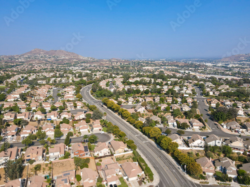 Aerial view of Southern California houses in inland town Corona, during hot summer. USA