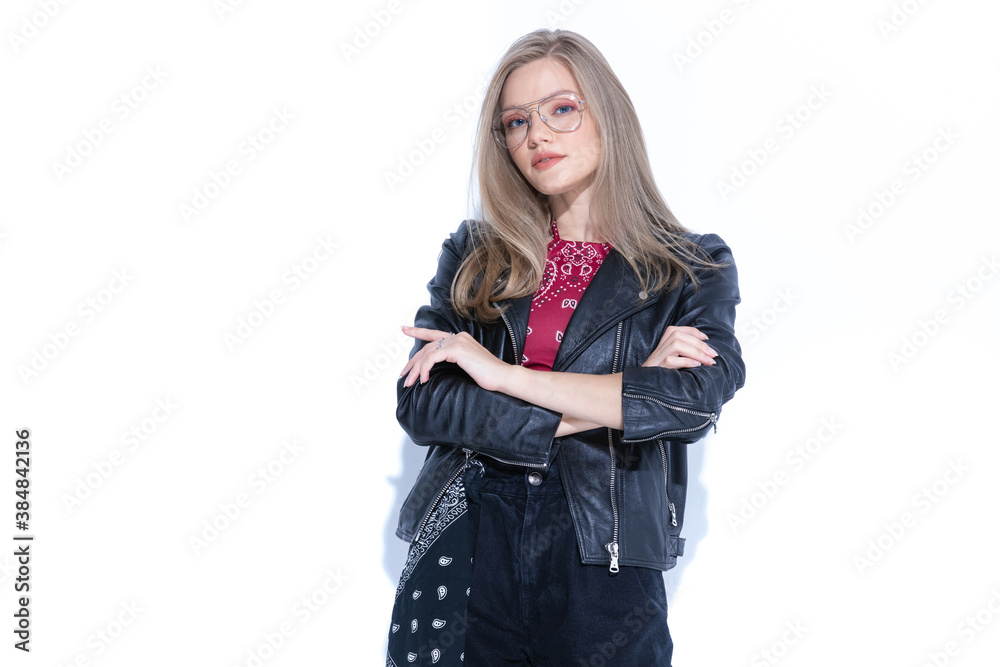 Charming fashion model holding hand crossed, wearing glasses Charming fashion model holding hand crossed, wearing glasses