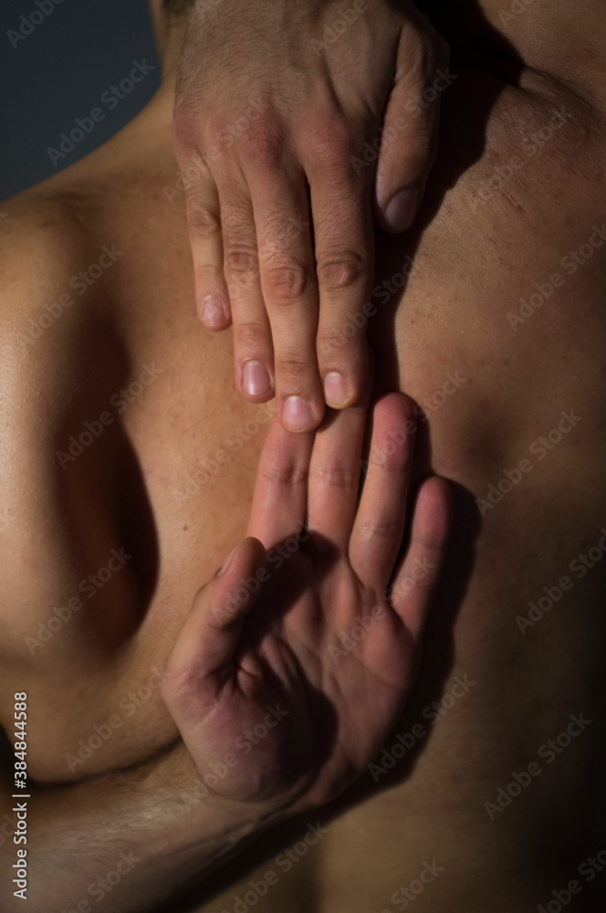 man's hands doing stretching