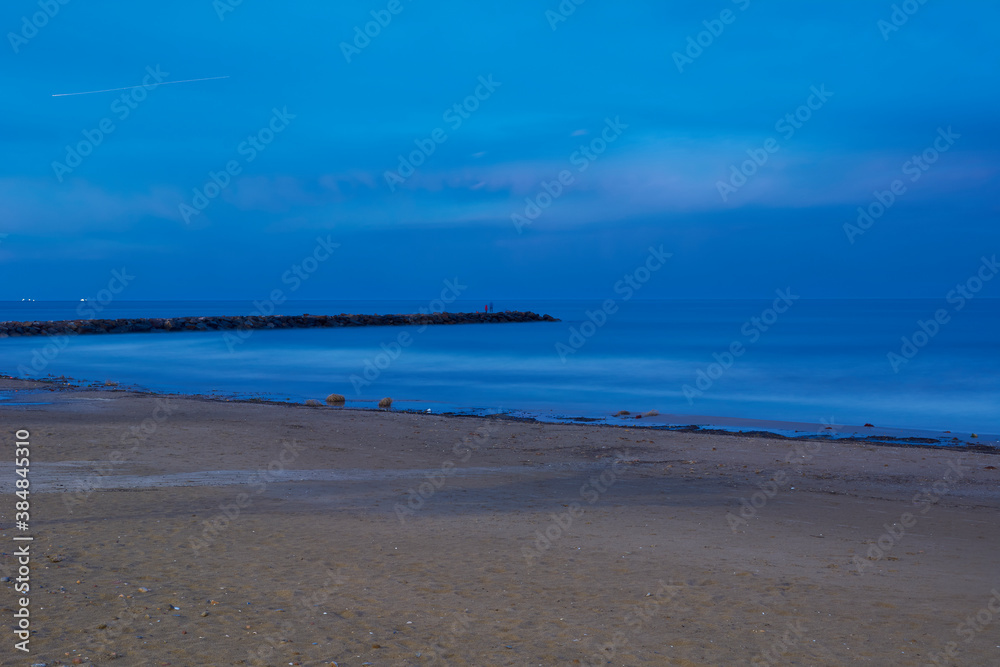 Breakwater on the beach at dusk