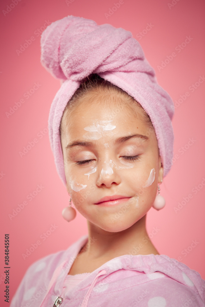 girl in a terry dressing gown and with a towel wrapped around her head girl in a terry dressing gown and with a towel wrapped around her head