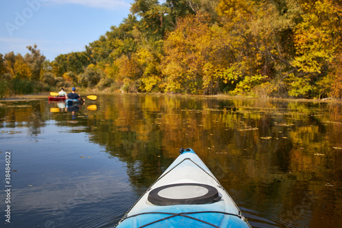 Autumn kayaking on beautiful lake, bow view © kobeza