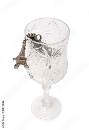 Apartment keys and Eiffel Tower keychain in glass. Isolated items on white background