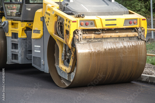 road roller smoothing the top layer of asphalt