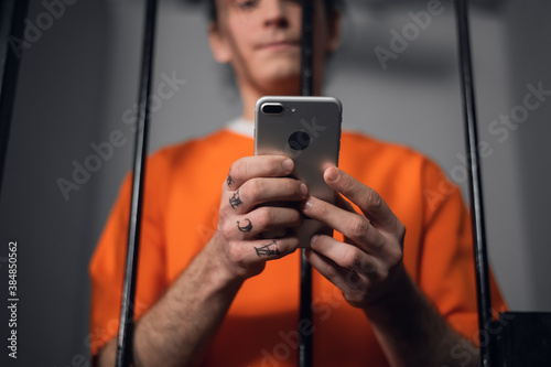 The criminal in the prison cell received a smartphone to communicate with relatives