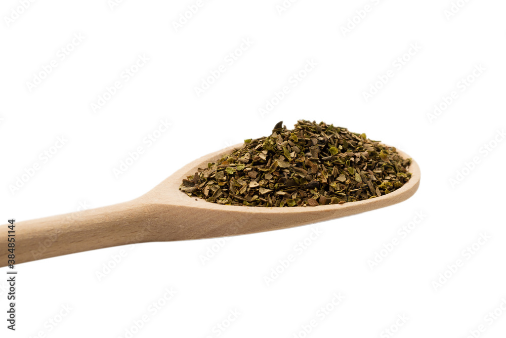 Oregano spice in wooden spoon isolated. Oregano spice in wooden spoon isolated.