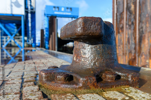 Wittduen, Schleswig-Holstein, North Friesland, Germany: rusty bollard at the ferry port of Wittduen on Amrum in the north sea photo