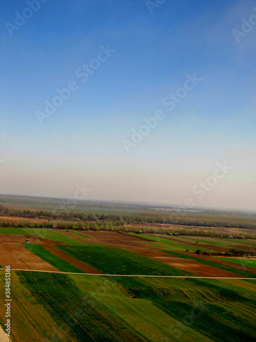 bird s eye view of colorful fields and meadows with a visible skyline  Serbia in the Balkans 