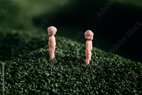 Small figurines in the grass photo