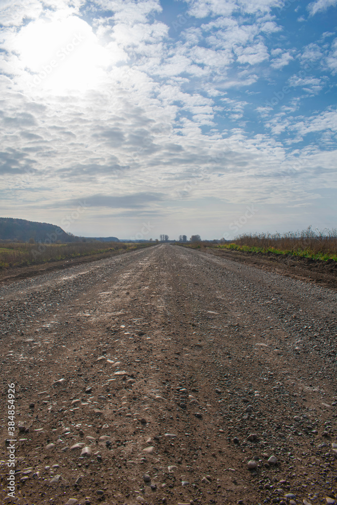 Naklejka premium Country road on a cloudy day