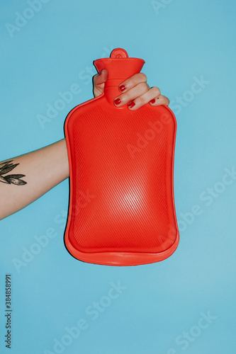 hand holding a hot water bottle for winter photo