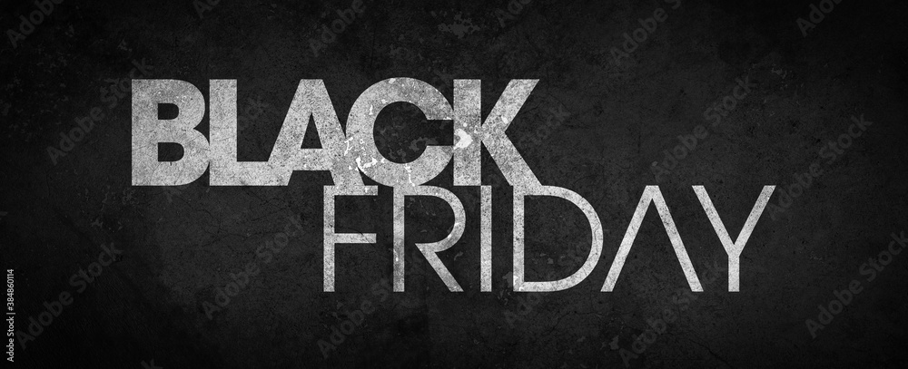 Fototapeta premium Black Friday inscribed in white on a black textured background - black grunge cement texture - high resolution background