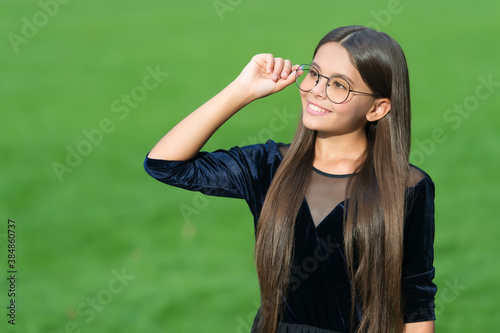 Eyewear to help you see better. Happy kid wear glasses green grass. Fashion eyewear. Vision correction. Corrective lens. Optical eyecare. Pediatric ophthalmology. Beauty look, copy space © be free